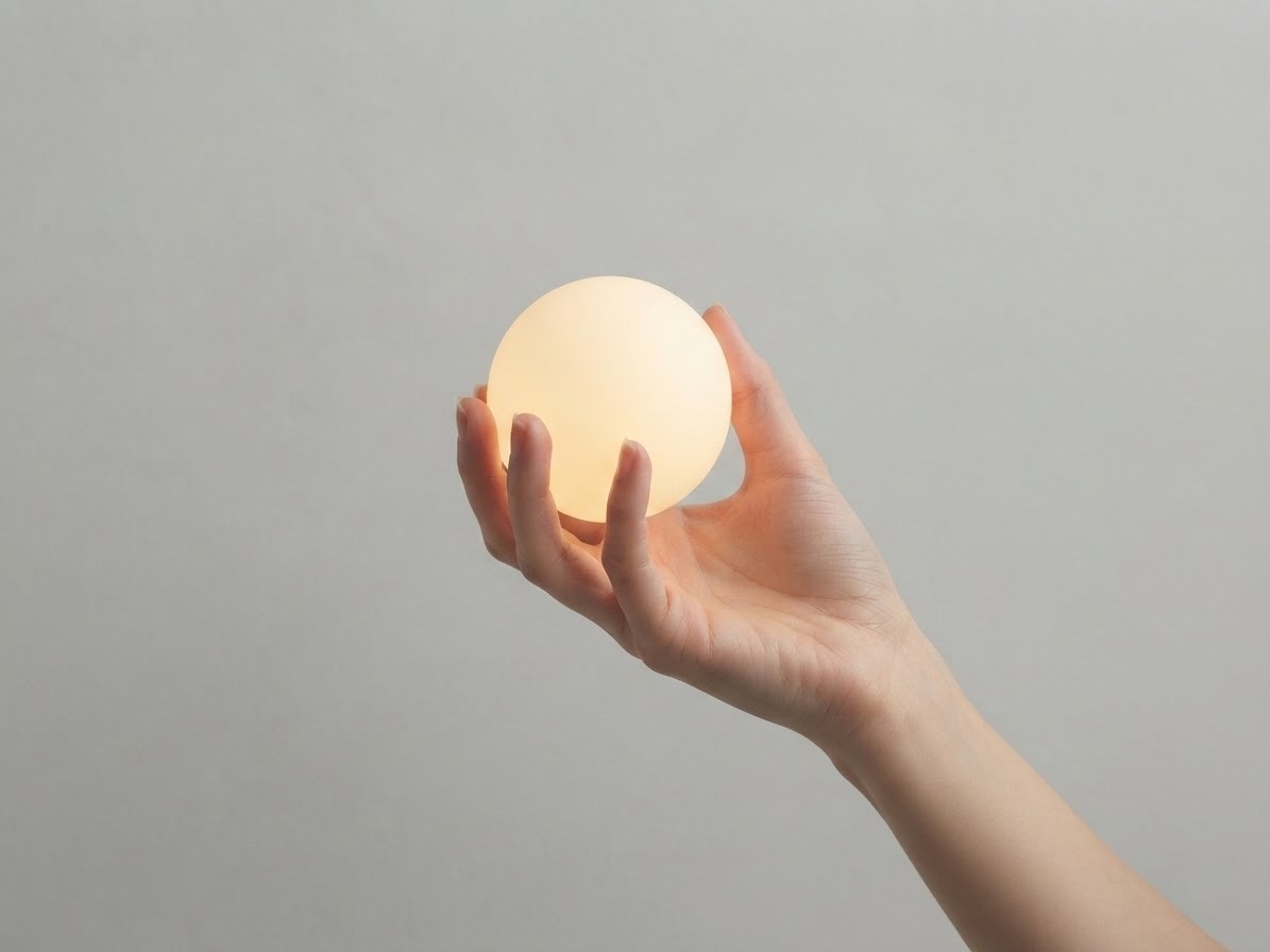 BAATI glowing sphere held in one hand